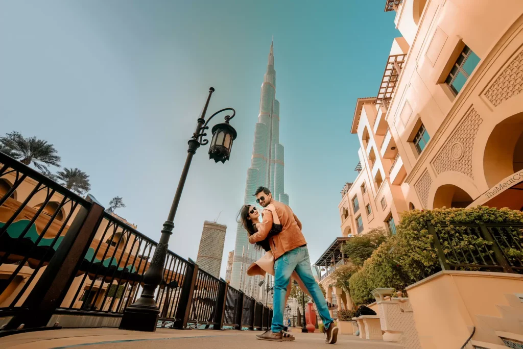 Couple posing in front of Burj Khalifa, Dubai pre-wedding