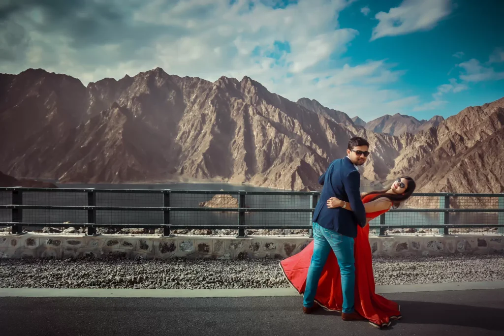 Couple posing on rocks at Hatta Dam, Dubai