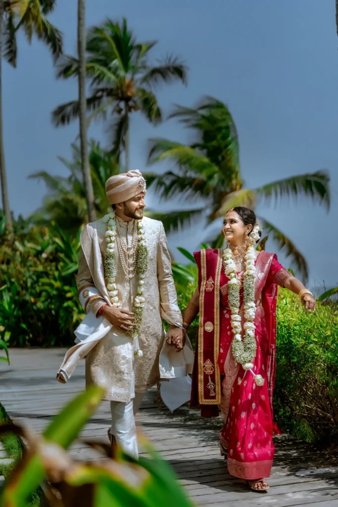 Bride and groom's candid moment by the seaside at Taj Green Cove