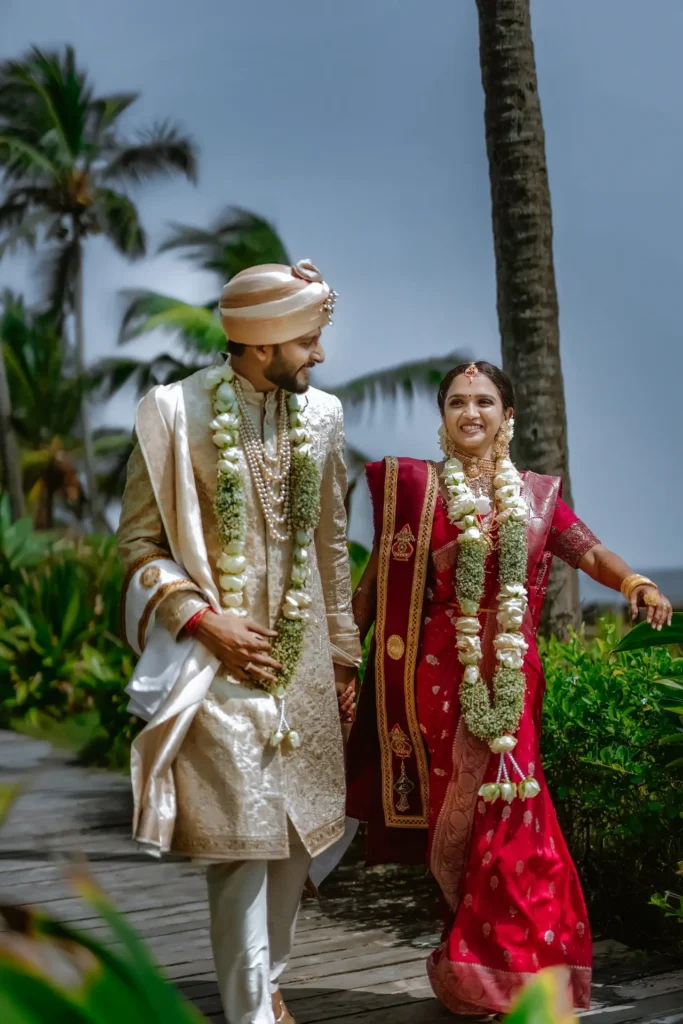 Wedding couple with greenery and sea backdrop at Taj Kovalam