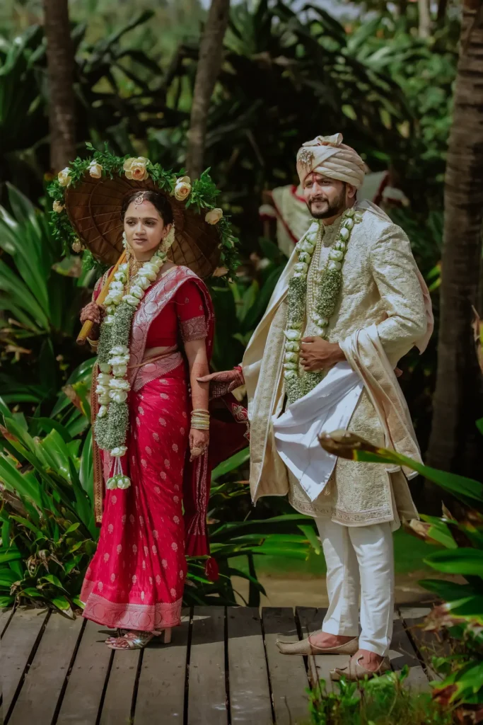 Traditional North Indian wedding couple by the sea at Taj Kovalam