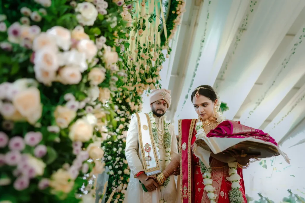 Wedding couple portrait surrounded by lush greenery at Taj Kovalam