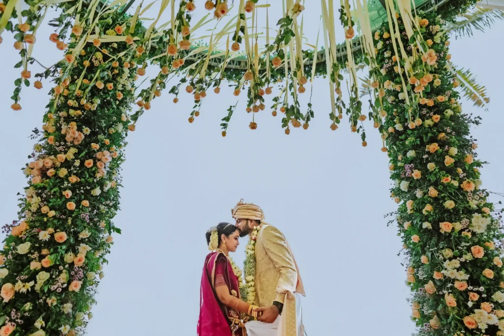 Couple kissing in front of ocean kovalam