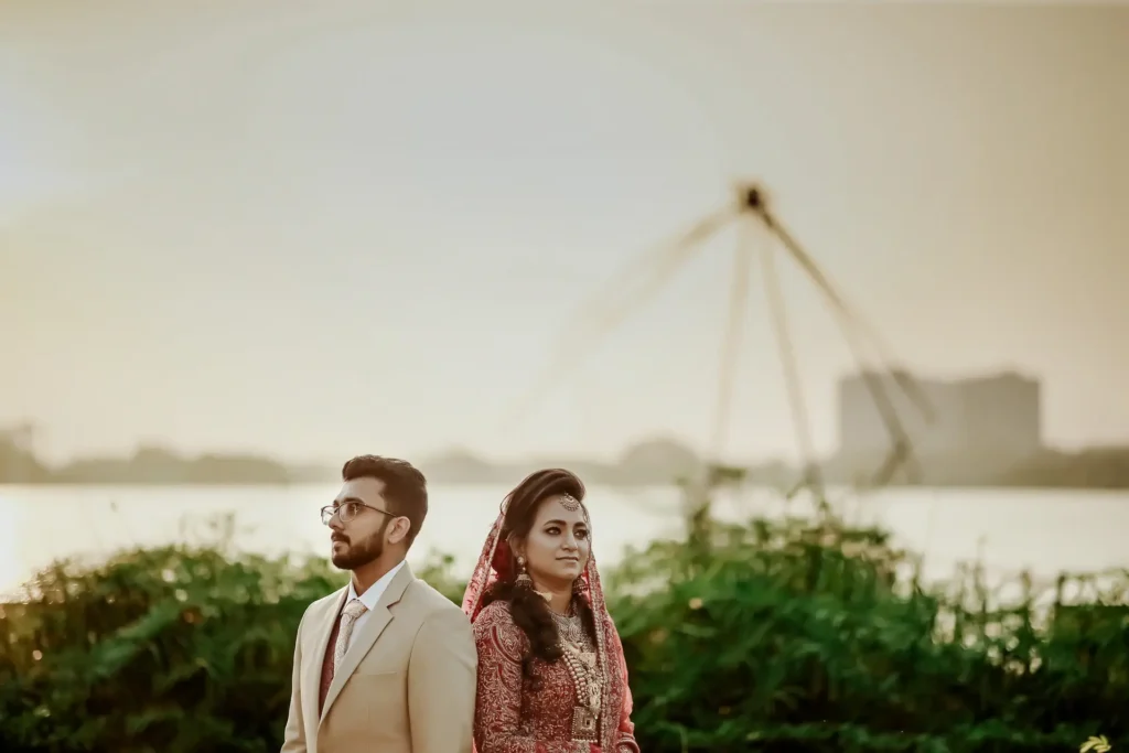 Muslim couple portrait with iconic Chinese fishing nets in background