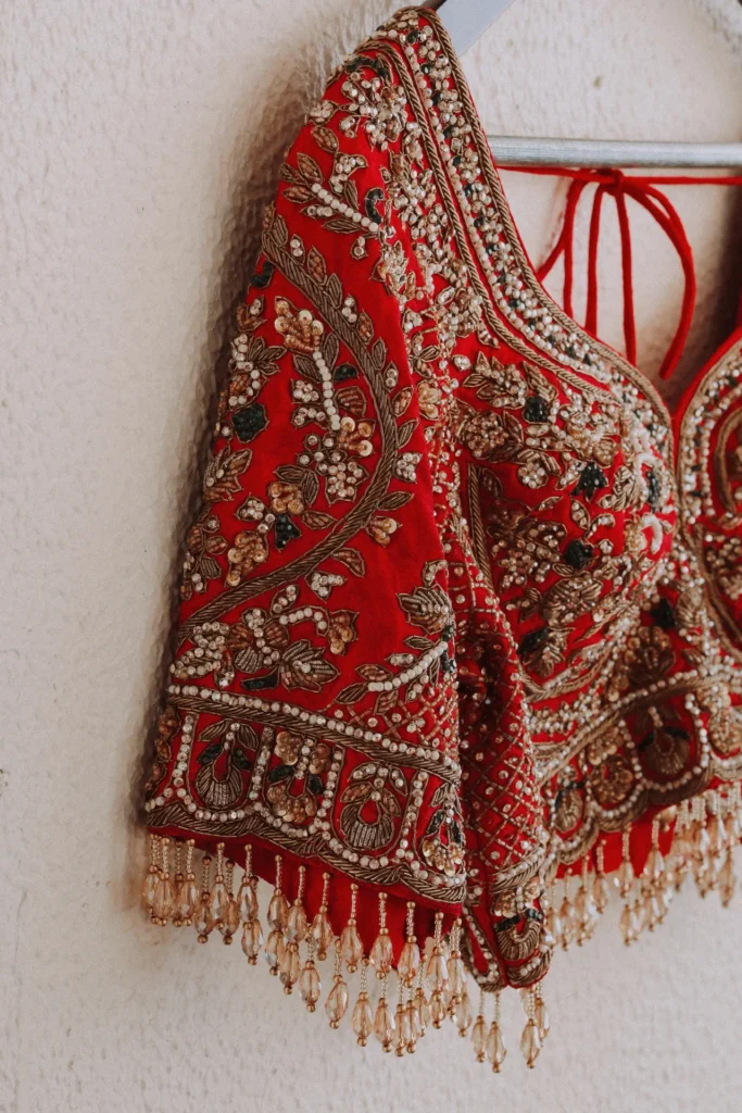 red blouse hanging at leela kovalam beach side wall