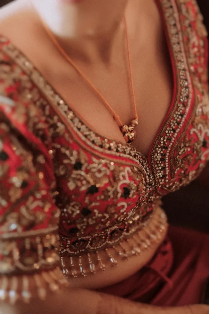 Bride wearing traditional blouse at leela wedding