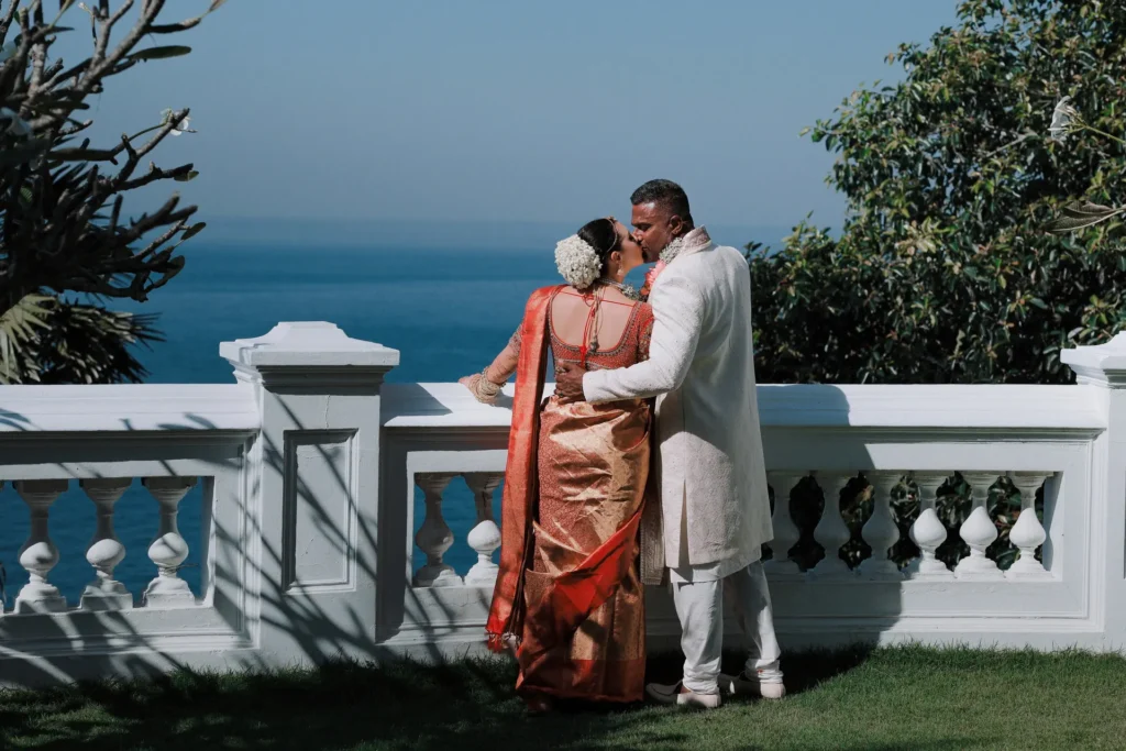 Bride and groom at sunset beach wedding in Kerala